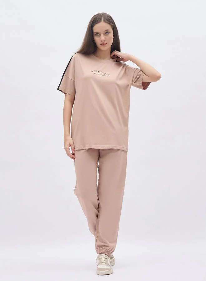 Styli Styli Beige Oversized Slogan T-Shirt and Cuffed Joggers Set