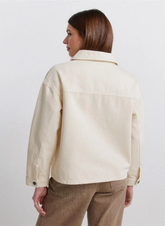Springfield  Coloured oversized denim jacket. Shirt collar. Button fastening with placket. Front patch pockets. A wash process using new technologies has been applied, reducing water, chemical and energy consumption. for Women | Best Price UAE