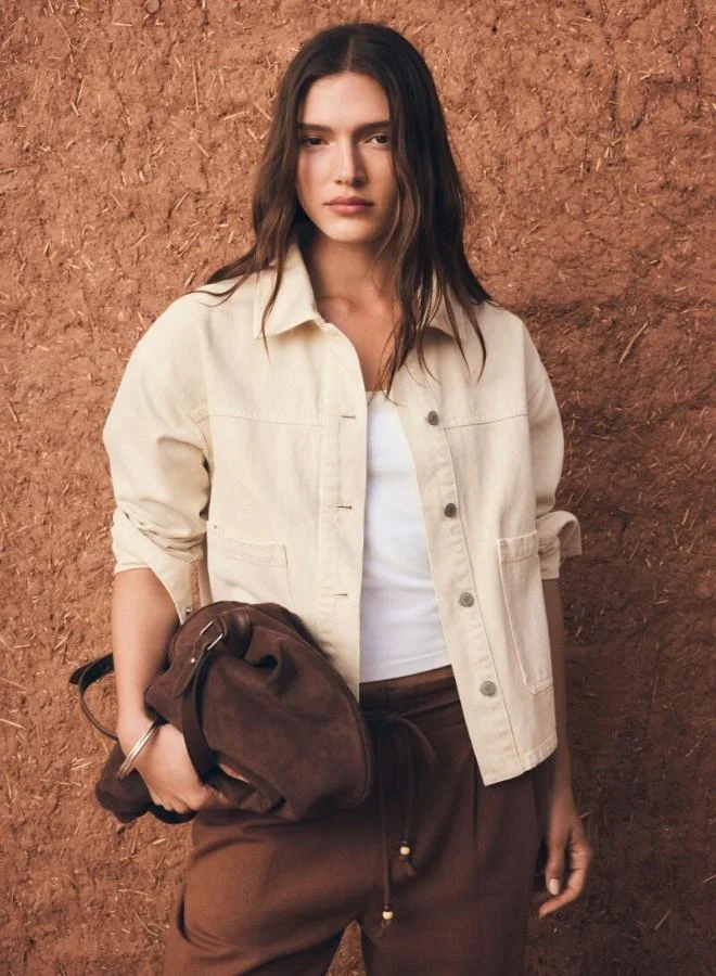 Springfield  Coloured oversized denim jacket. Shirt collar. Button fastening with placket. Front patch pockets. A wash process using new technologies has been applied, reducing water, chemical and energy consumption. for Women | Best Price UAE