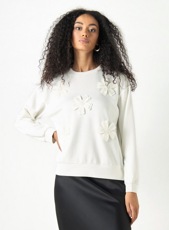 تواكستريمز سويت شيرت فضفاض بأكمام طويلة وزخرفة زهور من توإكستريمز - Image 1