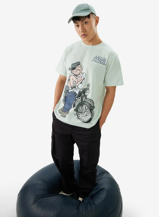 ذا سوليد ستور تيشيرت بقصة مريحة وطبعة جرافيك