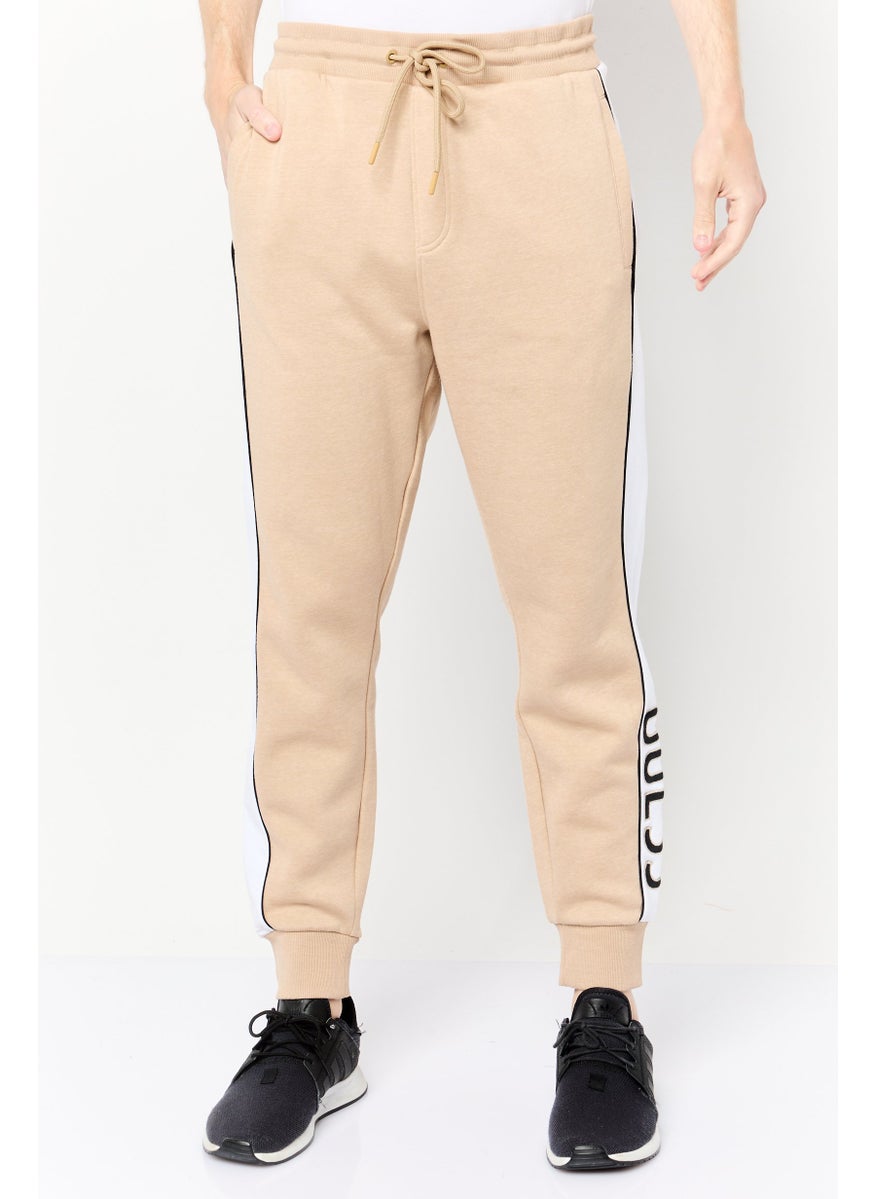 GUESS Men Regular Fit Brand Logo Jogger Pants, Beige  - Image 1