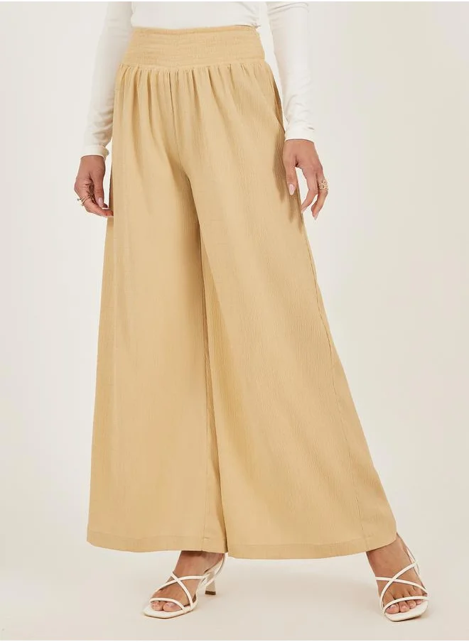 ستايلي Smocked Waist Mid Rise Wide Leg Pants