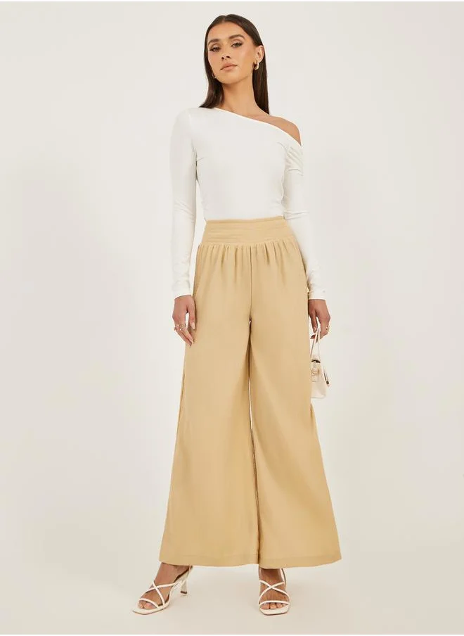 ستايلي Smocked Waist Mid Rise Wide Leg Pants