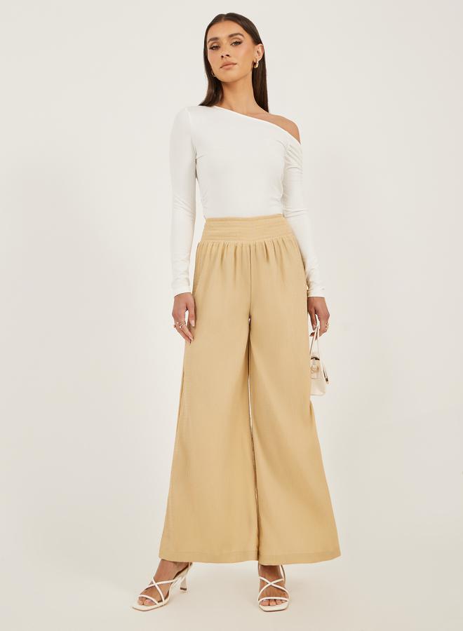 Styli Smocked Waist Mid Rise Wide Leg Pants  - Image 1