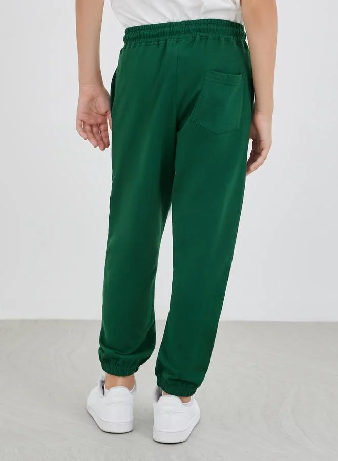Styli Styli School Uniform Green Solid Cuffed Joggers with Slip Pockets