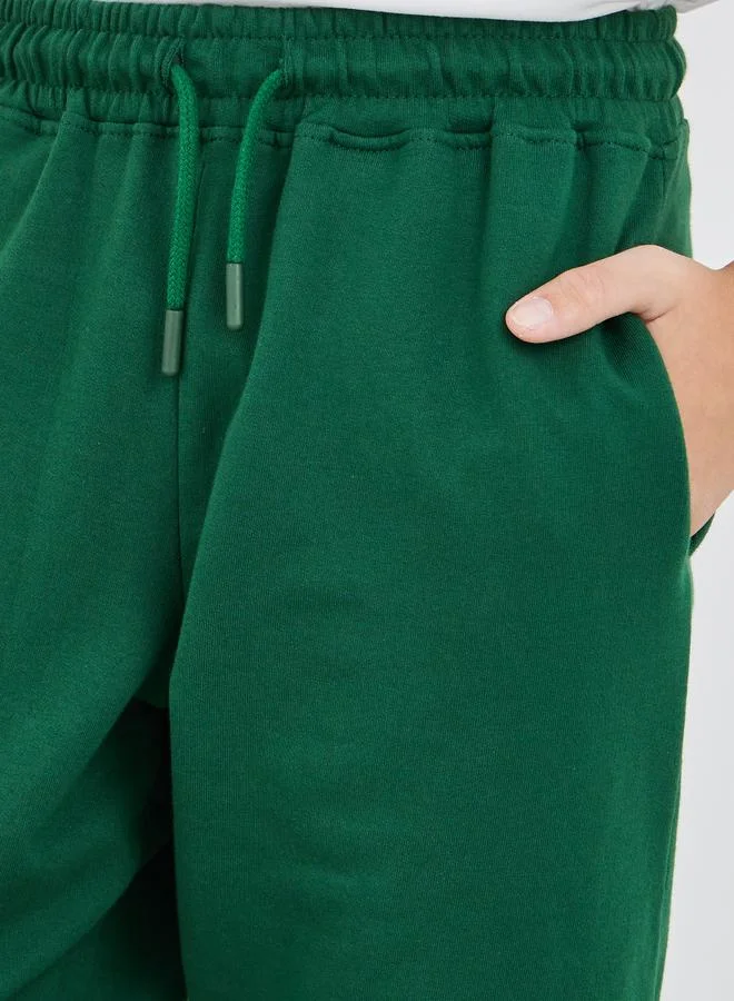 Styli Styli School Uniform Green Solid Cuffed Joggers with Slip Pockets