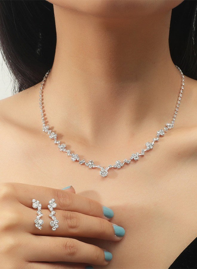 DUNISO مجموعة مجوهرات فضية من حجر الراين مكونة من 4 قطع للنساء لامعة ومحفظة مسائية ومحفظة بتصميم مموج وقلادة وأقراط وسوار للسيدات لحفلات العشاء وحفلات الزفاف - Image 4