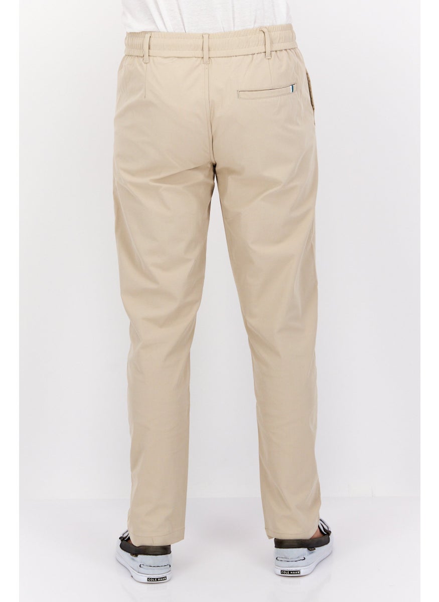 Men Regular Fit Solid Stretchable Straight Leg Pants, Tan - pzsku/ZF413CDE32FFF2A6807B6Z/45/_/1737641990/7b9b46ed-b26f-4e1a-a1f5-14b4e7d60ef9