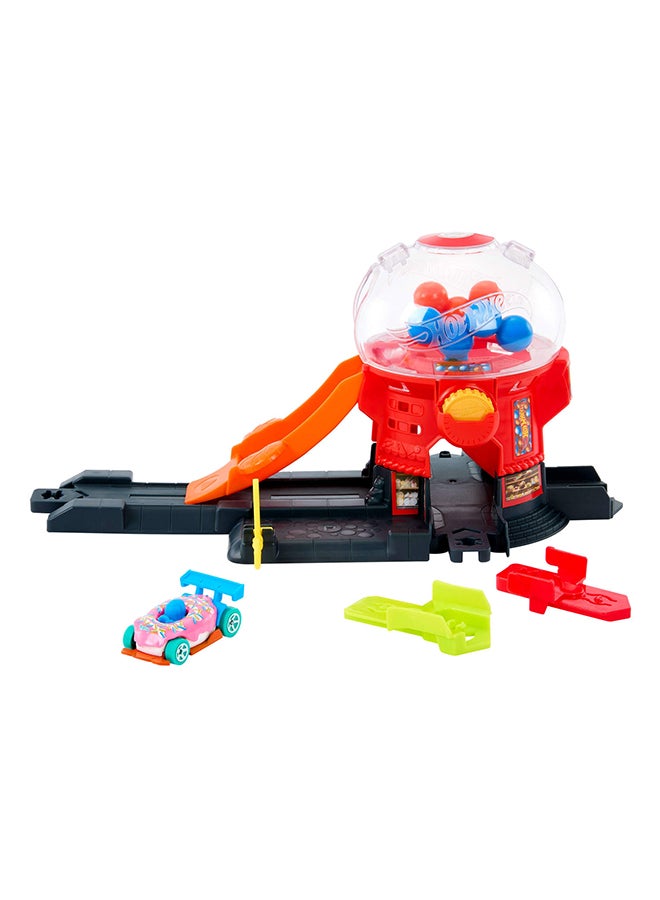 Hot Wheels Toy Car Track Set, Gumball Machine Playset with 1:64 Scale Die-Cast Donut-Shaped Vehicle & Speed Snap Track, Downtown City Candy Shop - Image 1