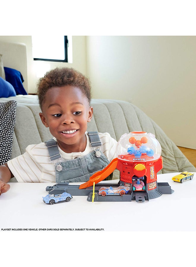 Hot Wheels Toy Car Track Set, Gumball Machine Playset with 1:64 Scale Die-Cast Donut-Shaped Vehicle & Speed Snap Track, Downtown City Candy Shop - Image 2