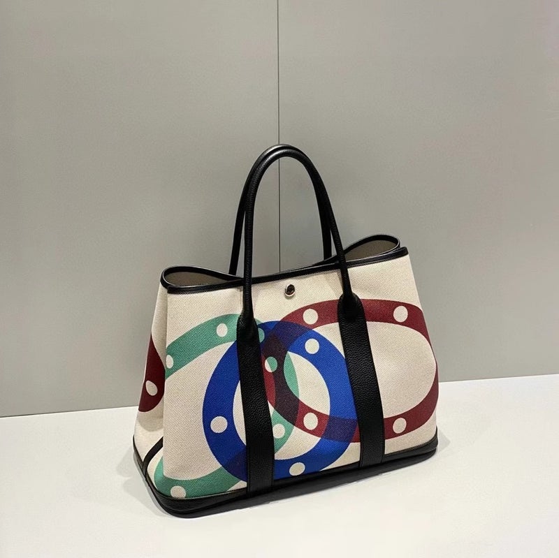 Explosive Canvas Leather Patch Color Garden Bag 2025 Summer Leisure Travel Art Graffiti Shoulder Handbag - Image 1
