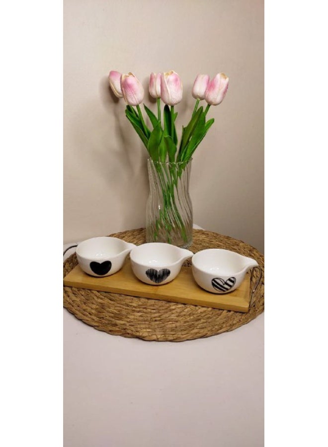 Set of 3 porcelain bowls on a wooden stand with a steel handle.