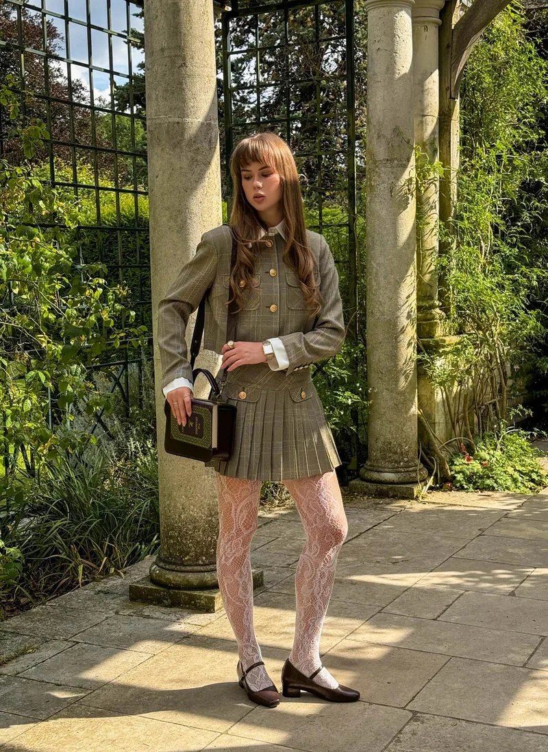 Mini checked skirt with large buttons on the pockets