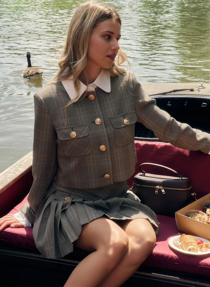 Lichi  Mini checked skirt with large buttons on the pockets for Women | Best Price UAE