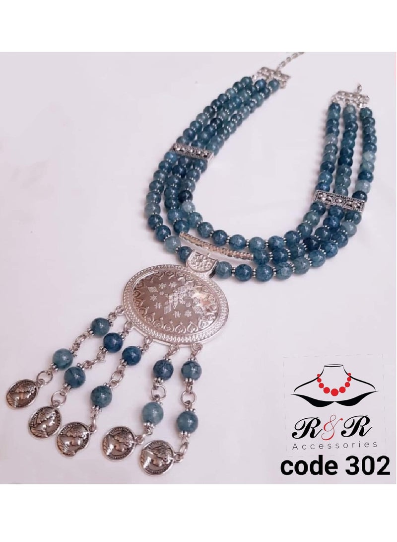 R&R A multi-role women's necklace of blue fasite agate max with spacers and a nickel silver pendant
