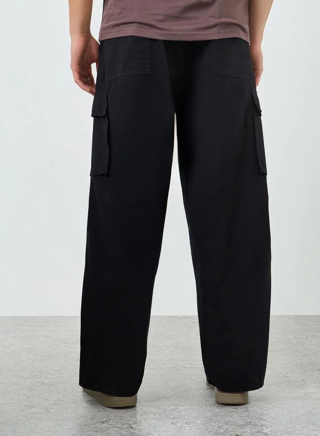 Styli  Men Black Woven Cotton Baggy Pants for Men | Best Price UAE