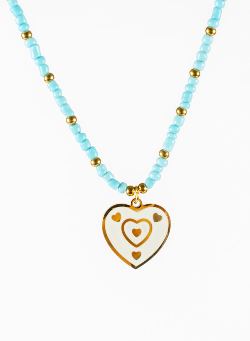 The Black Pearl Accessories Stainless Steel Necklace Gold With Turquise Beads and White Heart Pendant - Image 1