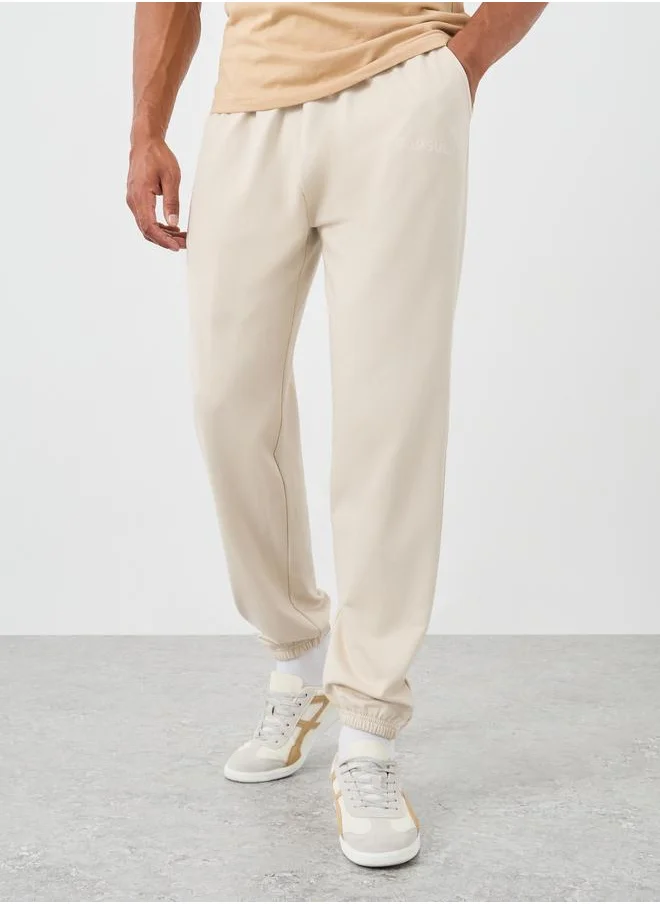 ستايلي Styli Typography Embossed Oversized Elasticated Cuffed Joggers