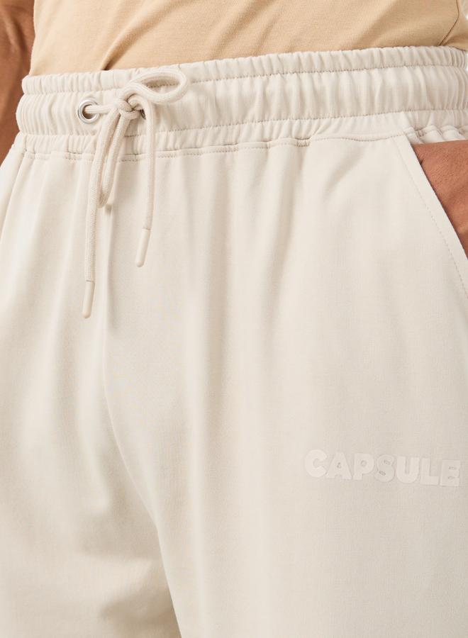 ستايلي بنطلون رياضي فضفاض مطاطي مزين بنقوش خطية - Image 3