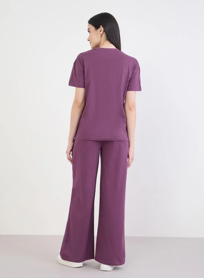 Styli Purple Slogan Boxy T-Shirt and Wide Leg Joggers Co-Ords