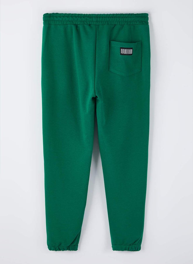 trendyol Green Regular/Regular Cut Pocket Top Label Detail Rubber Leg Track Suit - Image 4