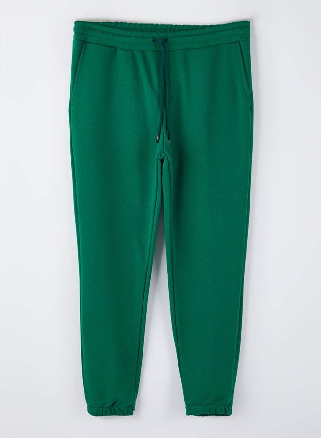 trendyol Green Regular/Regular Cut Pocket Top Label Detail Rubber Leg Track Suit - Image 1