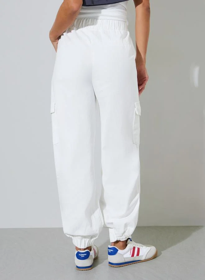 Styli  White Solid Mid-Rise Cuffed Cargo Jeans for Women | Best Price UAE