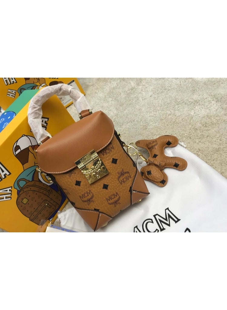 MCM Brown Monogrammed Top Handle Crossbody Bag with Gold-tone Lock and Dog Charm