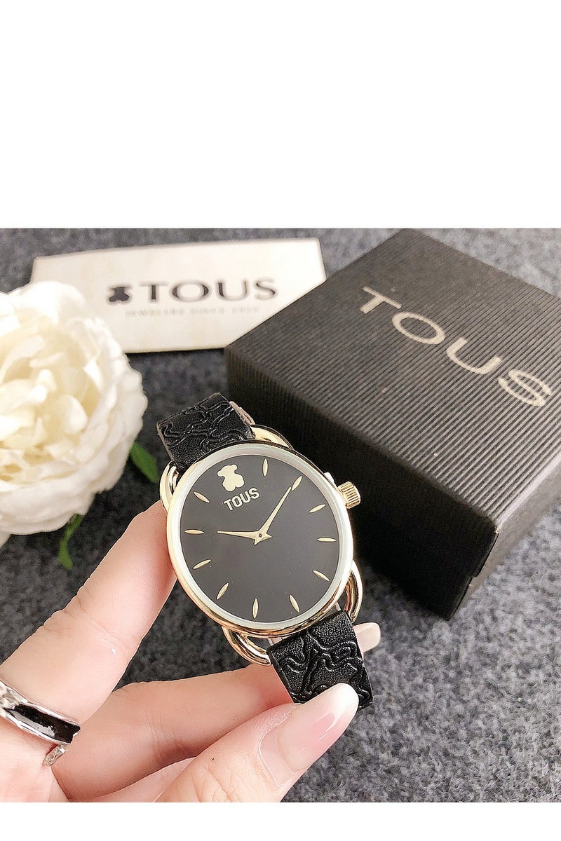 TOUS Black Embossed Strap Watch: Gold - Accented Oval Dial