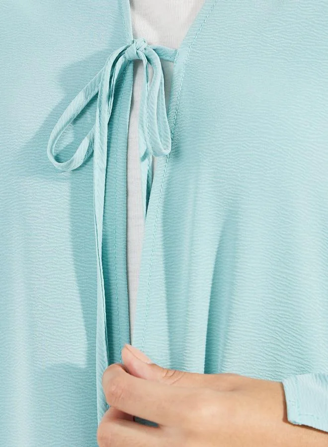 Styli Textured Abaya with Tie Front and Slit Sleeve Detail