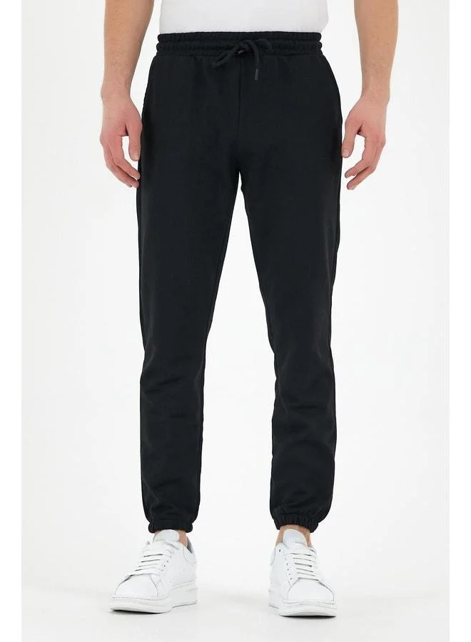 mmetalic Black Men’s Sweatpants with Labelled Back and Side Pockets, Regular Fit with Elastic Cuffs