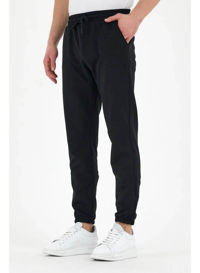 mmetalic Black Men’s Sweatpants with Labelled Back and Side Pockets, Regular Fit with Elastic Cuffs