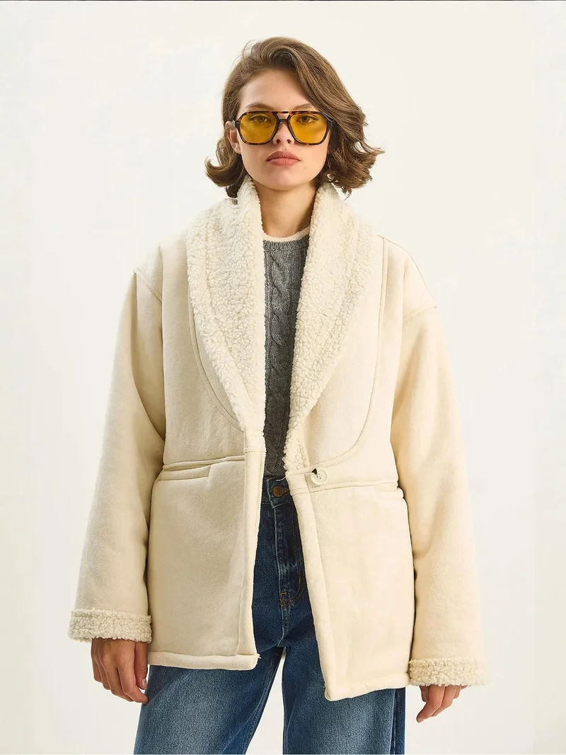 بيانكو لوتشي معطف بأزرار مزين بفرو صناعي من لوتشي