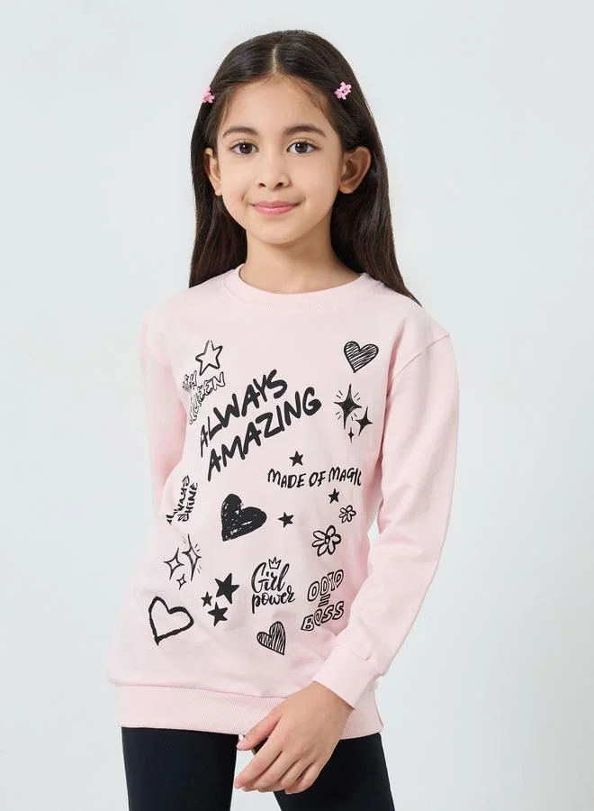 ستايلي طقم من سويت شيرت وردي بطبعة جرافيك وليقنز