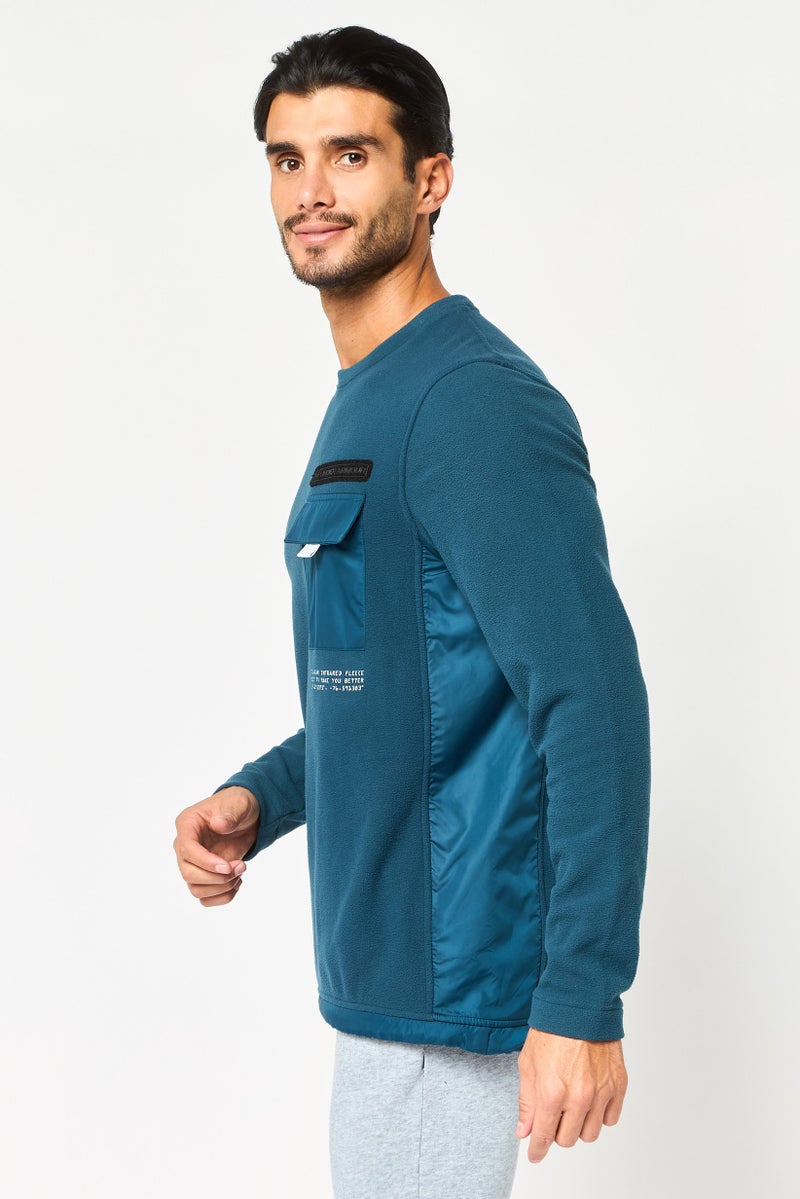 UNDER ARMOUR سويت شيرت خارجي طويل الأكمام للرجال بتصميم فضفاض، أزرق مائل إلى الأخضر - Image 3