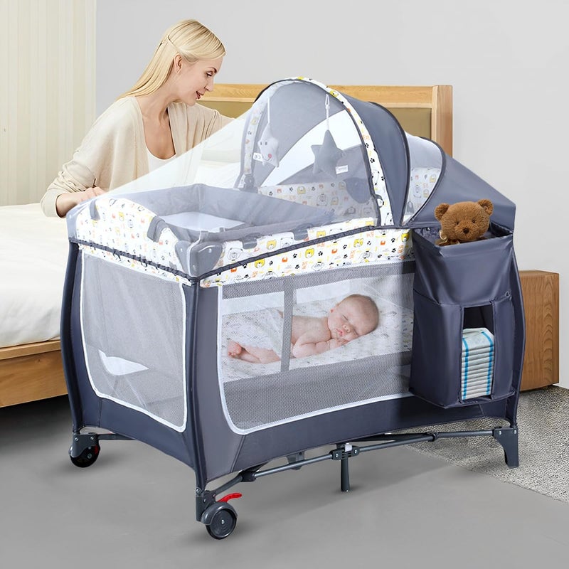 ANNA QUEEN 4 in 1 Pack and PlayPortable Nursery Center Baby Playard with Bassinet Changing TableFoldable Baby Crib Travel Playpen with WheelsRemovable Canopy with ToysStorage Bag Grey 
