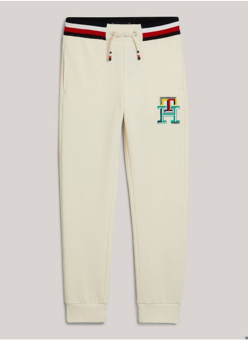 TOMMY HILFIGER - Boys' Th Monogram Embroidery Cuffed Joggers -  Pure cotton, Beige - Image 1