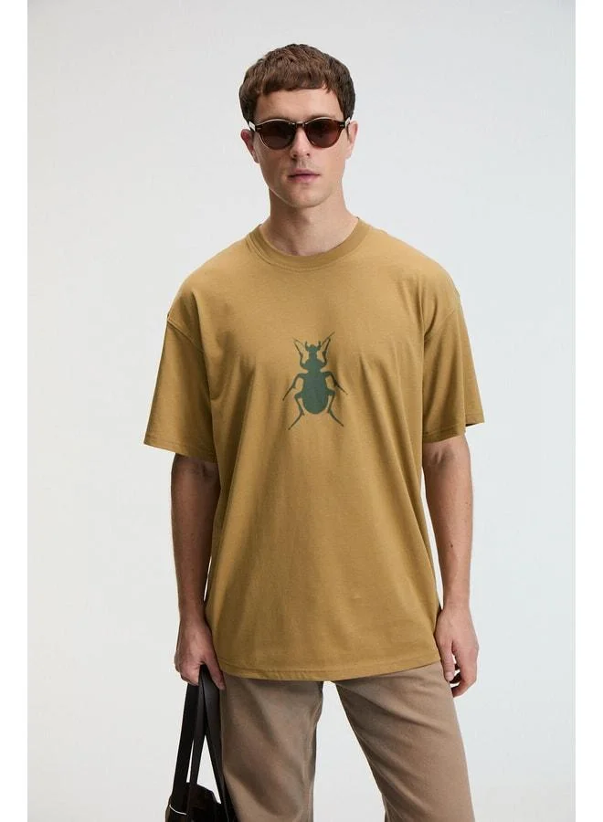 GRIMELANGE BOLD Men's 100% Cotton Oversized Fit Printed Short Sleeve Round Neck Dark Beige T-Shirt.