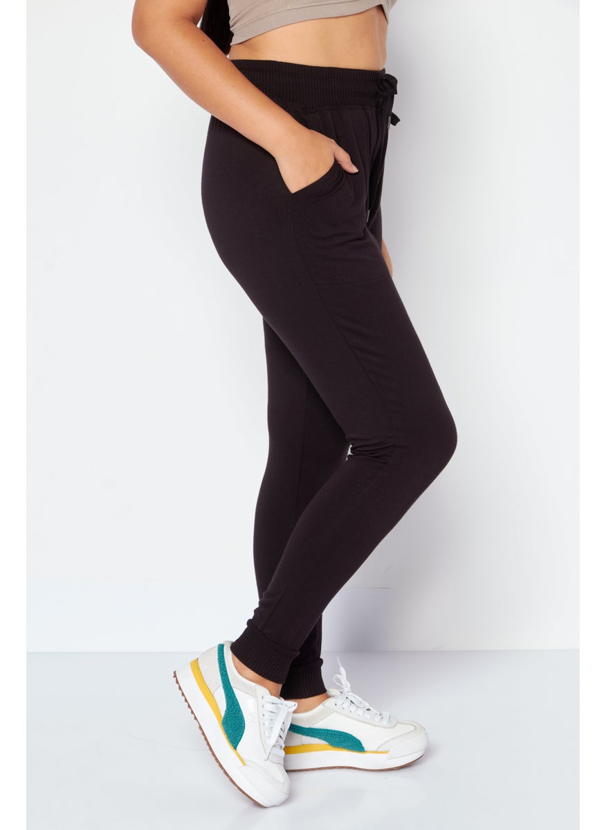 Women Regular Fit Plain Sweatpants, Black - pzsku/ZF5D00A31CB1296847312Z/45/_/1733148668/e9ad1083-bd60-44e5-a2bb-98a0394347b2