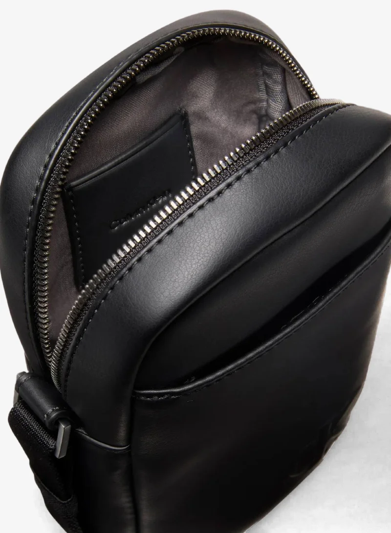 Calvin Klein Black Embossed Monogram Logo Slim Reporter Bag for Men | Best Price UAE