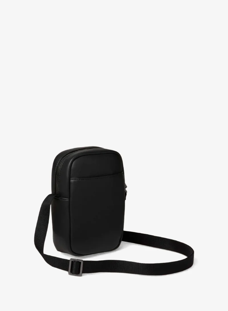 Calvin Klein Black Embossed Monogram Logo Slim Reporter Bag for Men | Best Price UAE