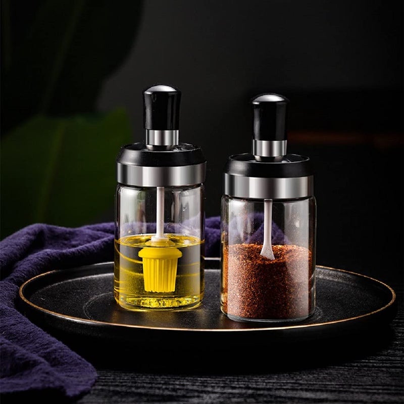 LOCANS Borosilicate Glass Food Storage Spice Salt Sugar Condiment Jar with Spoon and Olive Oil Bottle with Brush Combo for Kitchen Restaurants Airtight Cap Transparent Pack of 2 - Image 1