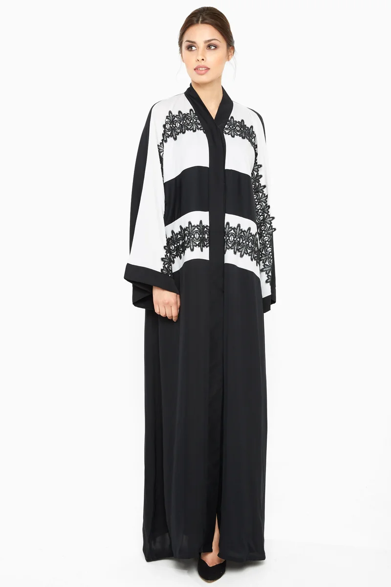NUKHBAA A casual abaya in black and white with stripe black lace detailing-Aj366A