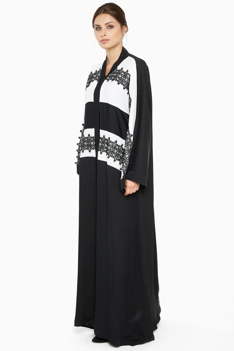 NUKHBAA A casual abaya in black and white with stripe black lace detailing-Aj366A