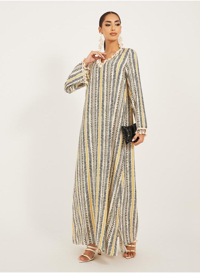 Styli - stripe pattern print A line jalabiya w/ shell tassel trim at neck and sleeve hem - Image 1