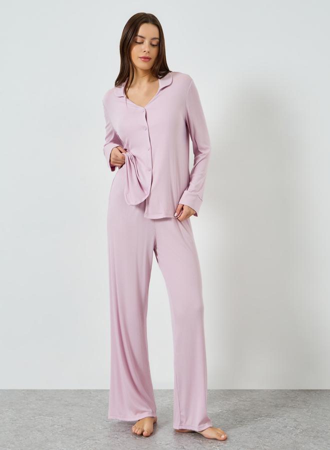 A set of pajamas and a shirt with buttons and an o...
