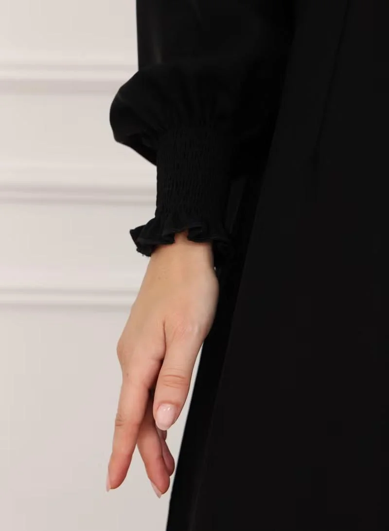 Nikias  Nikias Black Crepe Abaya With pleates and elastic In hands for Women | Best Price UAE