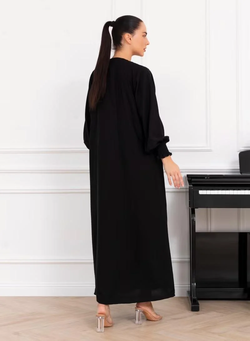 نيكياس عباية نيكاس سوداء كريب بطيات ومطاط في الأكمام