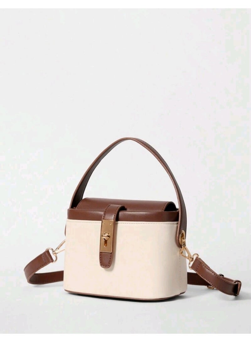 arab Women's handbag with a modern and elegant design. Features a chic beige and dark brown color combination with a gold-tone lock and adjustable shoulder strap. Perfect for daily use or special occasions, with a practical design that fits your essentials.  Dimensions: 10.5 cm (Height) × 17 cm (Width) × 13 cm (Depth)  Color: Beige and Brown  Gold-tone metal lock  Top handle and removable shoulder strap - Image 2